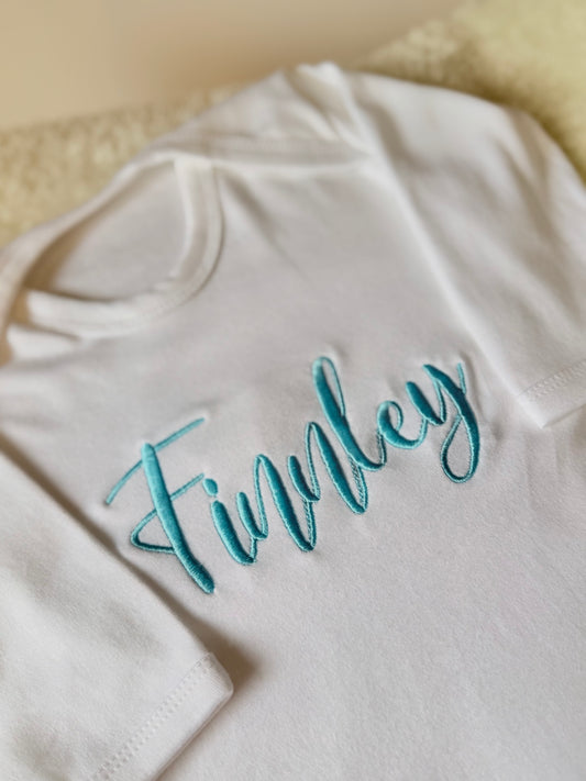 Embroidered babygrow with child's name