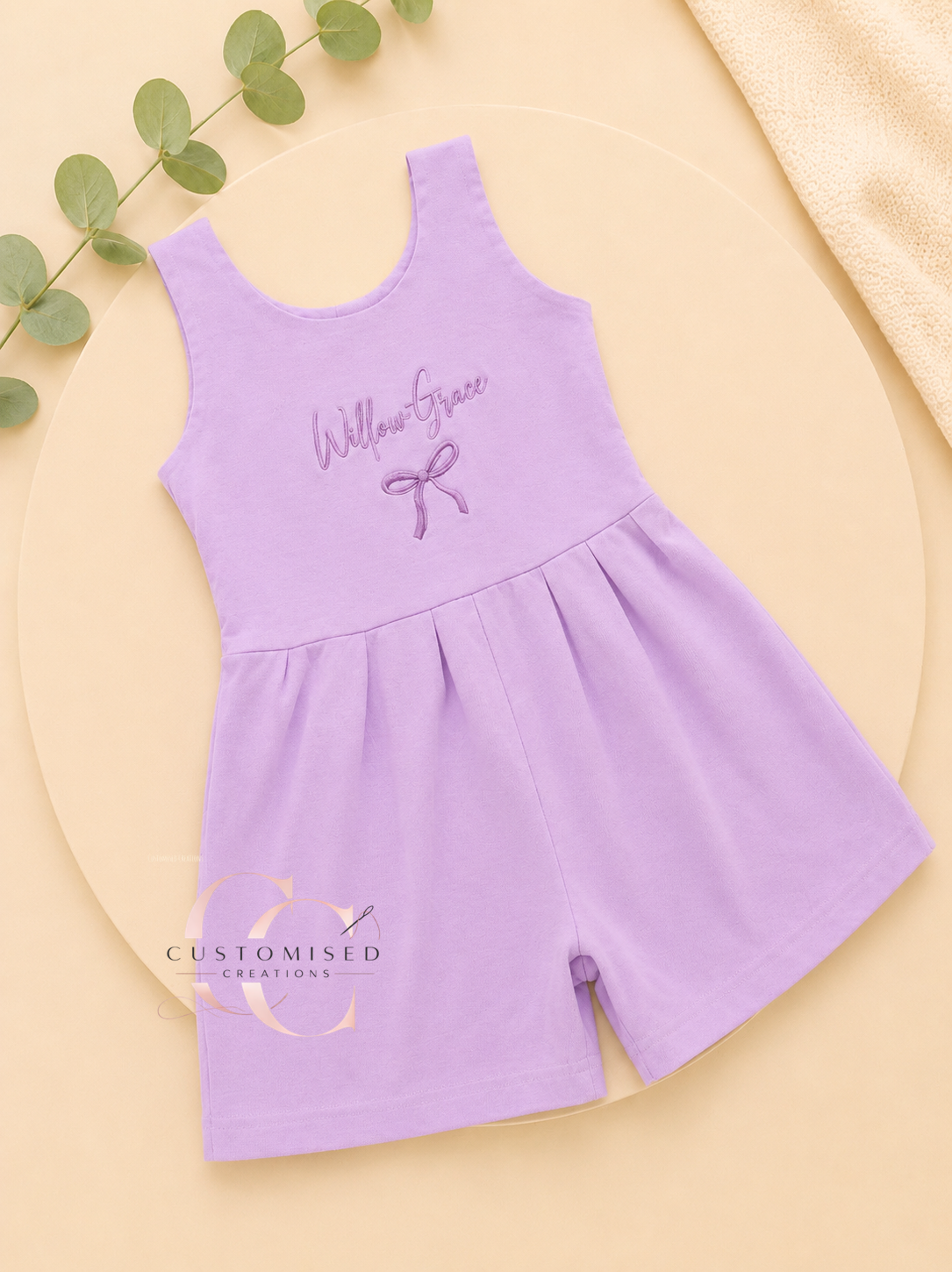 Embroidered girls bow all in one playsuit with bow design under name
