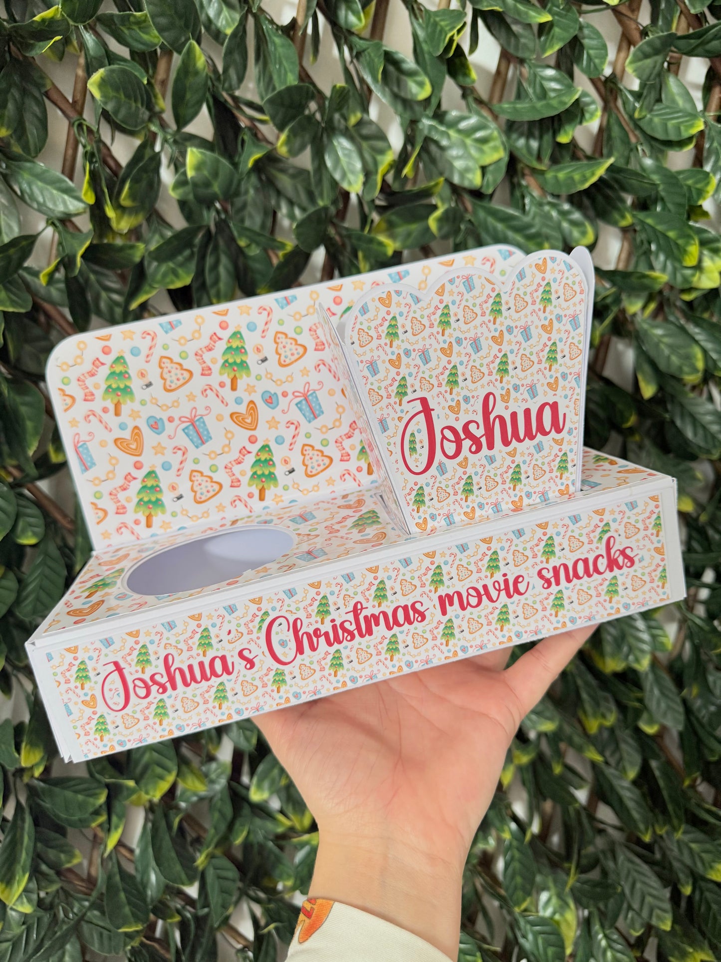 Festive Christmas movie snack tray with popcorn holder