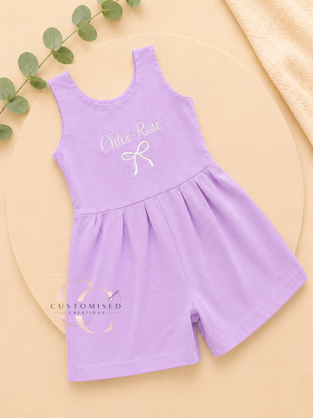 Embroidered girls bow all in one playsuit with bow design under name