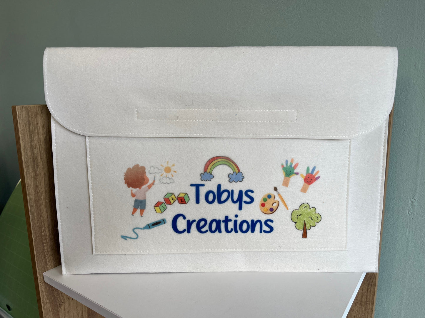 Cream children's drawings felt folder - all designs