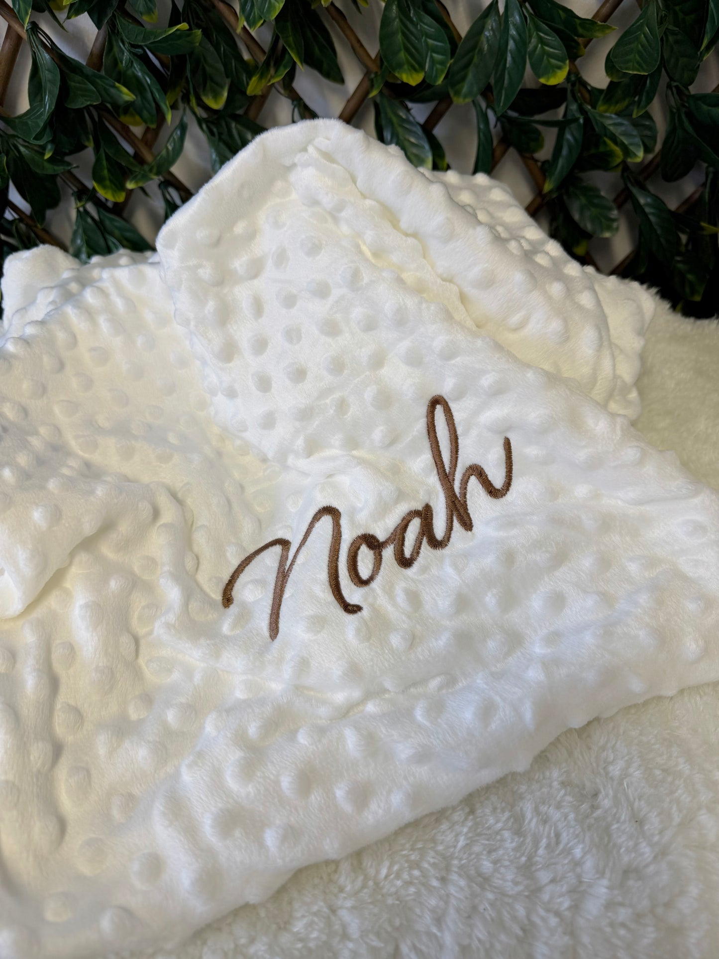 White embroidered bubble blanket